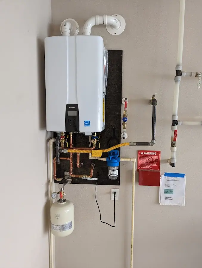 Professional plumber installing copper piping in a Woodson Terrace home