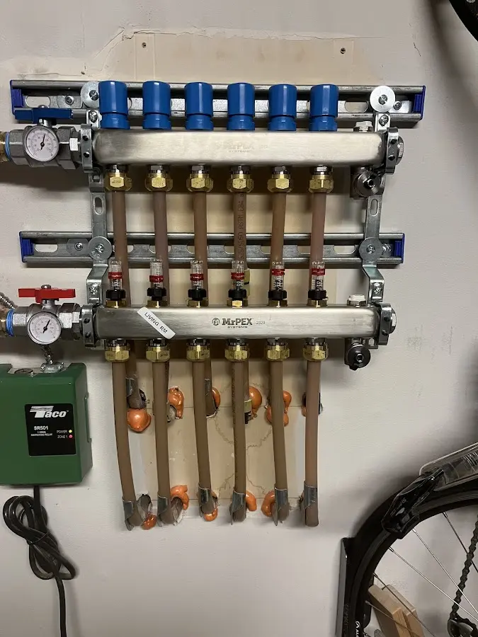 Plumber performing Gas Line Installation at a residential property in Woodson Terrace